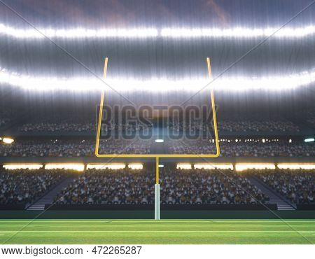 An American Football Stadium With Posts On A Marked Green Grass Pitch At Night Under Illuminated Flo