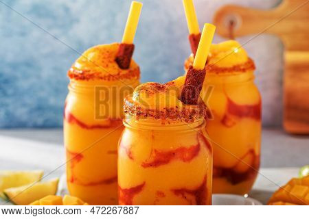 Mangonada Mexican Mango Smoothie With Chamoy Sauce And Lime Seasoning