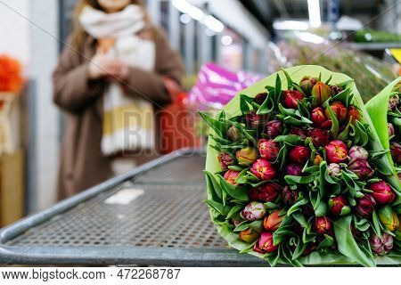 A Large Bouquet Of Tulips On A Shelf On A Large Flower Shop, Flower Market. High Quality Photo