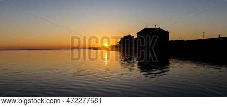 Panorama Of The Sun Going Down Behind The Dike In Wilhelmshaven, Germany