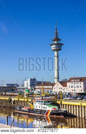Bremerhaven, Germany - March 09, 2022: Colorful Police Ship In Front Of The Radar Tower Of Bremerhav