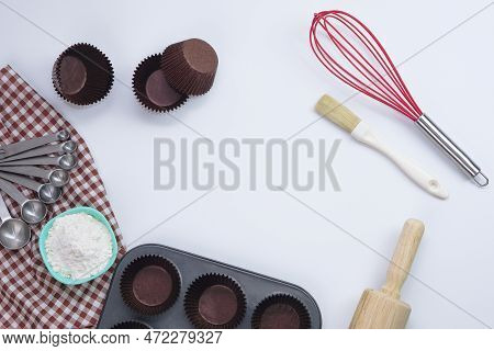 Top View Set Of Kitchen Utensils And Ingredients For Bakery On White Background. Materials Or Kitche