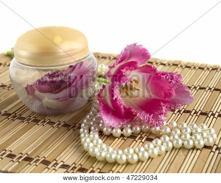 Pearl Necklace And Flower Petals In A Jar