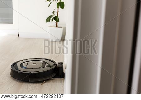 Robot Vacuum Cleaner Return To Charging At Dock In Clean Room Floor