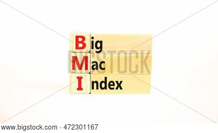 Bmi Big Mac Index Symbol. Concept Words Bmi Big Mac Index On Wooden Blocks On A Beautiful White Tabl