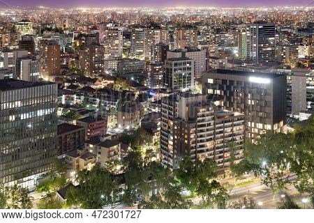 Elevated View Of Providencia District At Night In Santiago De Chile