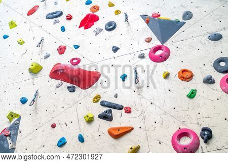 Artificial Climbing Wall With Grips And Carabiners In The Interior