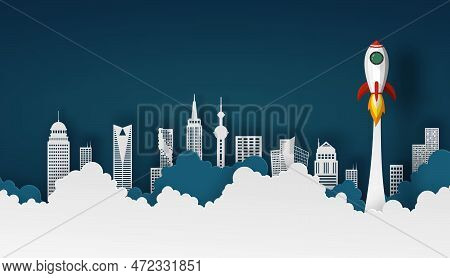 Spaceship Or Rocket Launch Into The Sky Over Buildings In City Scape View On Night Sky Background An
