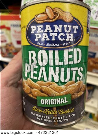 Grovetown, Ga Usa - 02 -01 23: Grocery Store Hand Holding Peanut Patch Can Boiled Peanuts