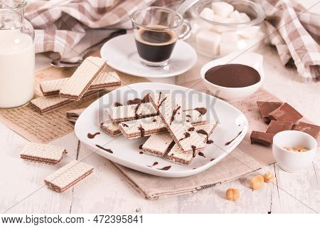 Neapolitan Wafers Filling With Hazelnut-chocolate Cream On White Dish.