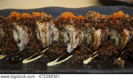 Aburi Salmon Roll Consist Of Crab Meat With Soft Shell Crab, Sushi Rice And Rolled Up. After That, T