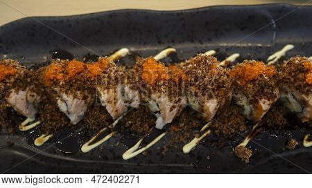Aburi Salmon Roll Consist Of Crab Meat With Soft Shell Crab, Sushi Rice And Rolled Up. After That, T