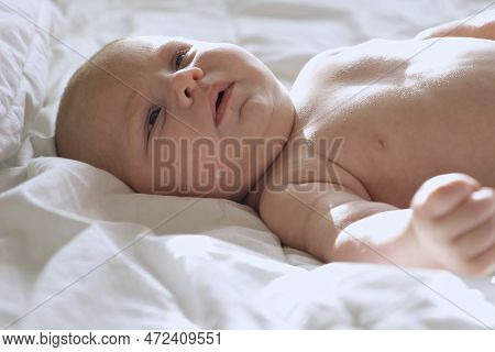 Baby Regurgitates Breast Milk. Little Baby With Milk On Her Cute Face. Authentic Close Up Footage Of