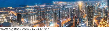 Abstract Blurred Bokeh Boke Background Of Illuminated Cityscape With Skyscrapers In Dubai Resort Tow