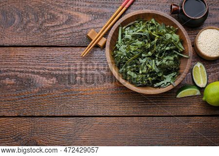 Fresh Laminaria (kelp) Seaweed Served On Wooden Table, Flat Lay. Space For Text