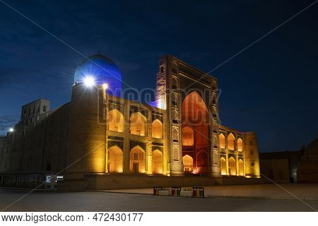 Bukhara, Uzbekistan - September 11, 2022: A View Of The Medieval Mir-arab Madrasah In A Night Light 