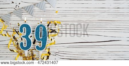 Number 39 Blue Celebration Candle On White Wooden Background. Happy Birthday Candles. Concept Of Cel