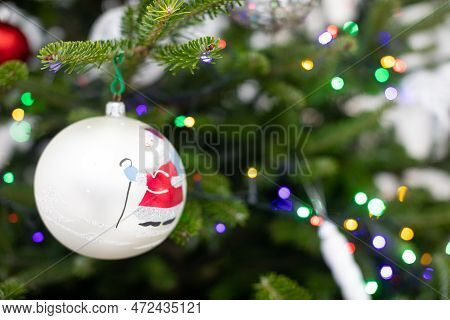 Christams Tree With White Bauble With Santa Claus.