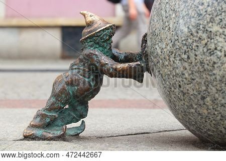 Wroclaw, Poland - May 11, 2018: Sisyphus Gnome Or Dwarf Small Statues In Wroclaw, Poland. Wroclaw Ha