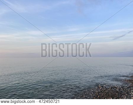 Sea And Morning Sky. Seasonal Pure Tranguil Sea, Horizontal Outdoors Landscape. Climate, Travel, Pea