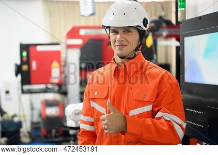 Smiling Portrait Of Professional Engineer Posing And Looking At Camera