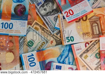 Multicurrency Background Of Us Dollars, Euros And Swiss Francs