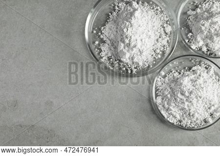 Petri Dishes With Calcium Carbonate Powder On Light Grey Table, Flat Lay. Space For Text