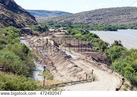 Boegoeberg Dam, South Africa - Feb 28 2023: Backhoe Loaders Clearing Sand That Blocked The Irrigatio