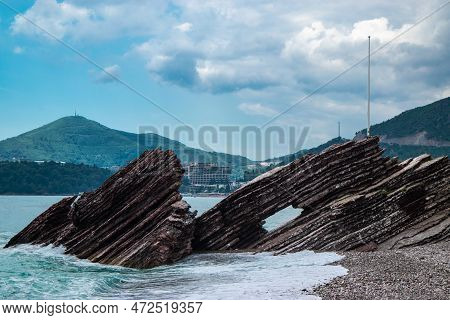Beautiful Rocks On Pebble Public Stone Beach. Rafailovici Esort Towns. Mountenegro. Adriatic Sea. Su