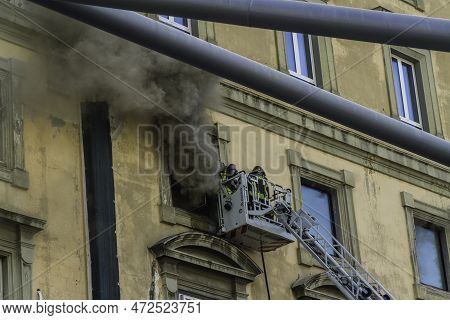Editorial, Domestic Apartment Fire With Smoke Billowing From Window. Garibaldi Square, Naples, Italy