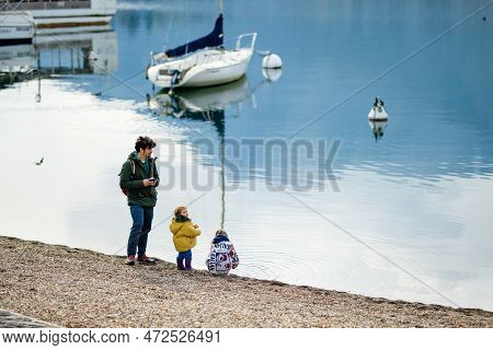 Lecco, Italy - April 2022: Tourists And Locals Spending Sunny Spring Day In Lecco, A Town On The Sho