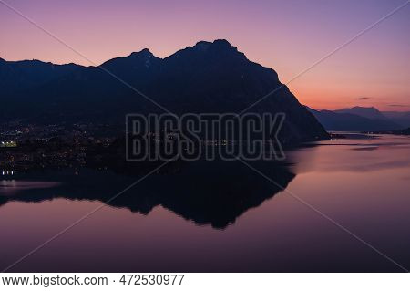 Stunning Aerial Cityscape Of Lecco Town On Spring Evening. Picturesque Waterfront Of Lecco Town Loca