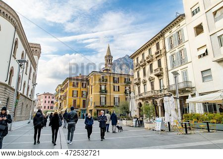 Lecco, Italy - April 2022: Tourists And Locals Spending Sunny Spring Day In Lecco, A Town On The Sho