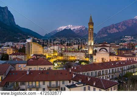 Stunning Aerial Cityscape Of Lecco Town On Spring Evening. Picturesque Waterfront Of Lecco Town Loca