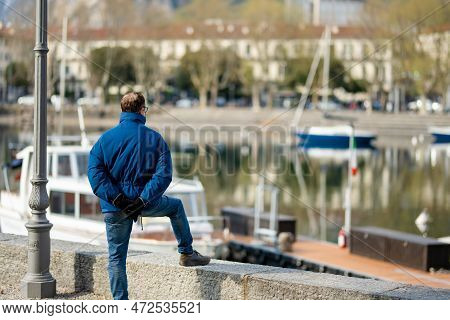 Lecco, Italy - April 2022: Tourists And Locals Spending Sunny Spring Day In Lecco, A Town On The Sho