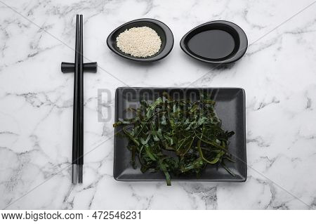 Fresh Laminaria (kelp) Seaweed Served On White Marble Table, Flat Lay