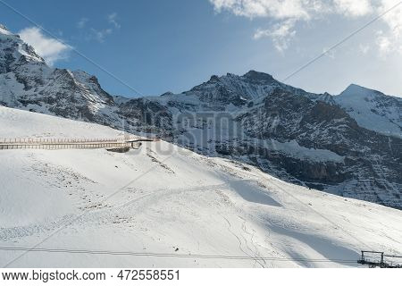 Eigergletscher, Canton Bern, Switzerland, February 11, 2023 Panoramic View Along The Snow Covered Al