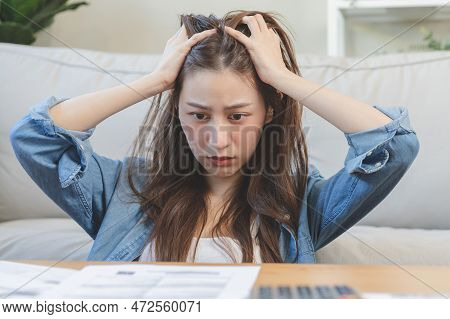 Financial Owe Asian Woman, Female Hand In Cover Face, Sitting In Stressed And Confused By Calculate 