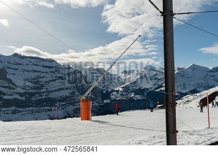 Eigergletscher, Canton Bern, Switzerland, February 11, 2023 People On Skis Are Driving Down The Alpi