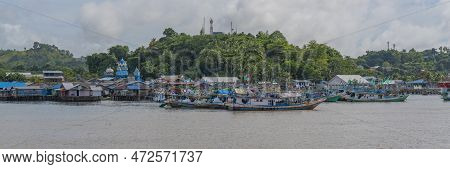 View From The Ferry To Waisai At Sorong With Boats And Houses And A Mosque