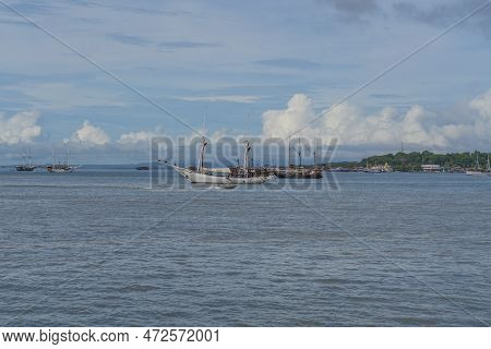 View From The Ferry To Waisai At Sorong With Cruises And Tour Boats, Background Blue Sky, Copy Space