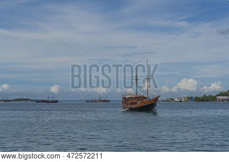 View From The Ferry To Waisai At Sorong With Cruises And Tour Boats, Background Blue Sky, Copy Space