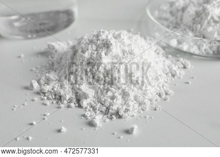 Heap Of Calcium Carbonate Powder On White Table, Closeup