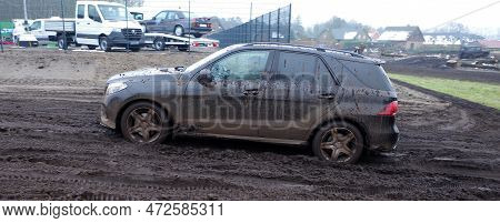 Itterbeck, Germany March 12 2023 A Totally Dirty Mercedes Suv Driving On A Offroad Track Trough The 