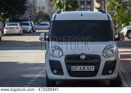 Side, Turkey -february 05, 2023:  White Fiat Doblo   Is Parked  On The Street On A Warm Summer Day A