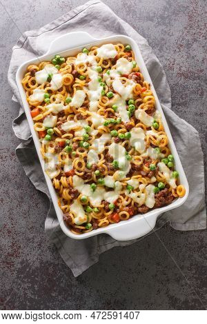 Anelli Pasta Casserole With Tomatoes, Cheese, Minced Meat, Green Peas, Carrots And Celery Close-up I