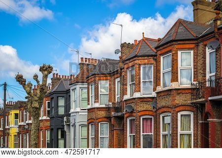 A Row Of Typical Red Brick British Terraced Houses Around Kensal Rise In London