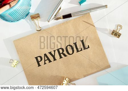 Craft Envelope With Text Payroll Isolated On Office Background
