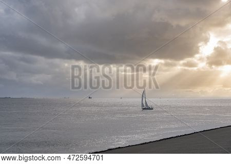 Sailboat Cruises In Front Of The Beach At Boulevard Evertsen In Vlissingen. Provinz Zeeland In The N