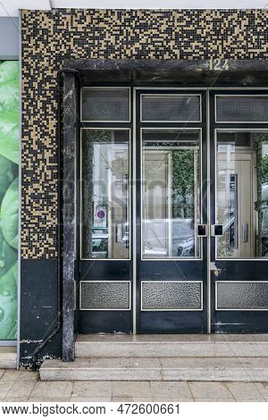 Lisbon, Portugal- October 21, 2022: Aluminum Door With Geometric Details On Tiled Facade In Lisbon
